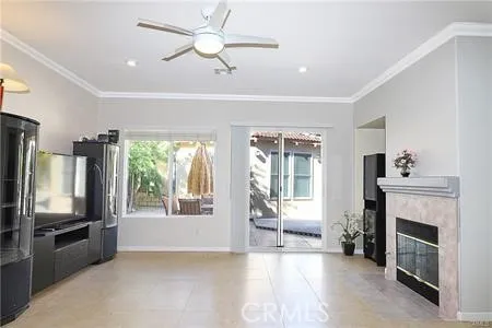 a kitchen with kitchen island granite countertop a refrigerator a stove a sink dishwasher a dining table and chairs with wooden floor