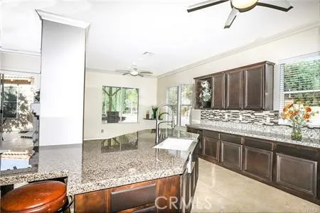 an empty room with a empty space and a ceiling fan