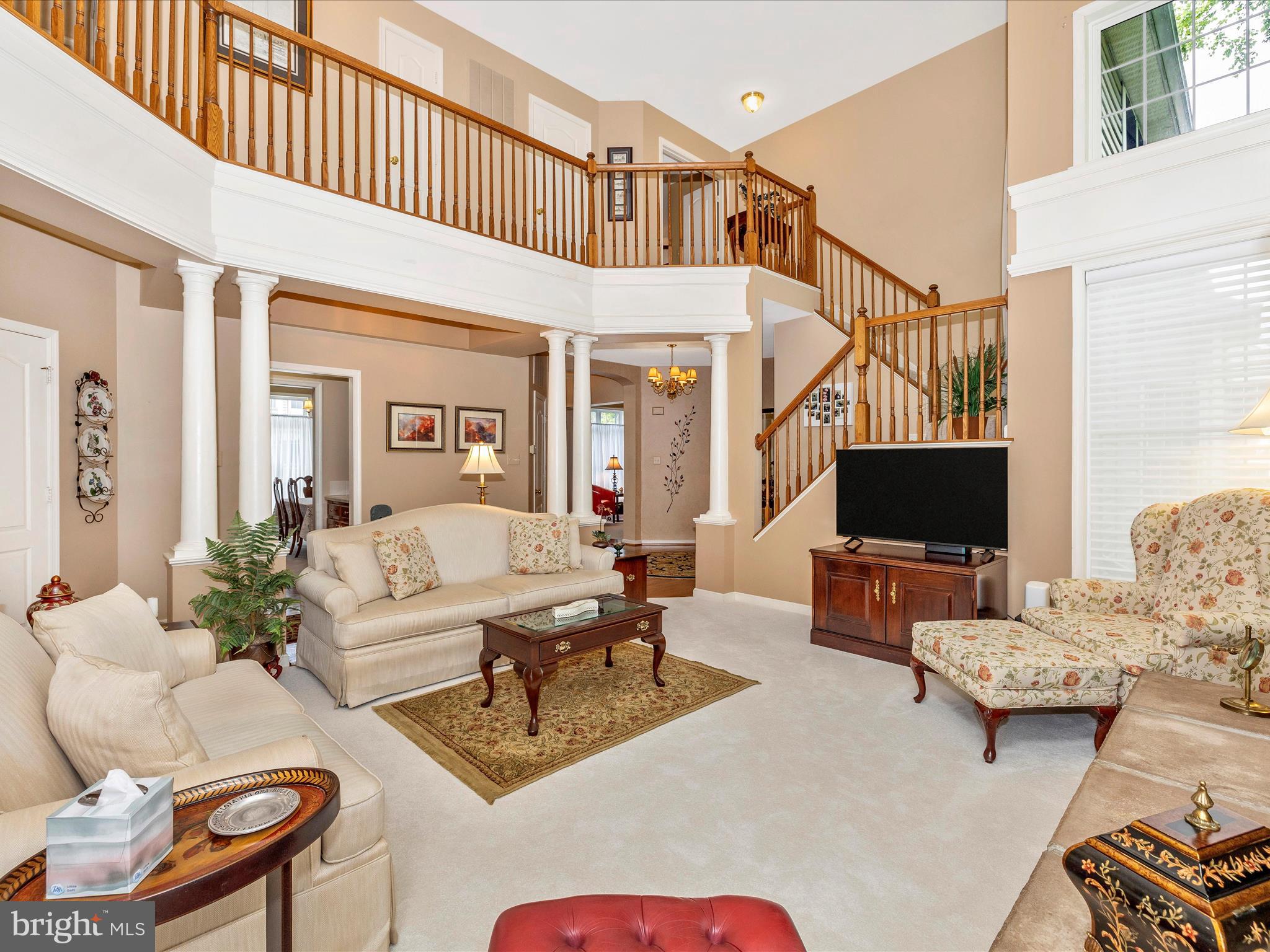 2594 Bear Den Road Frederick, MD 21701 - Photo 12 of 72 a living room with furniture and a flat screen tv