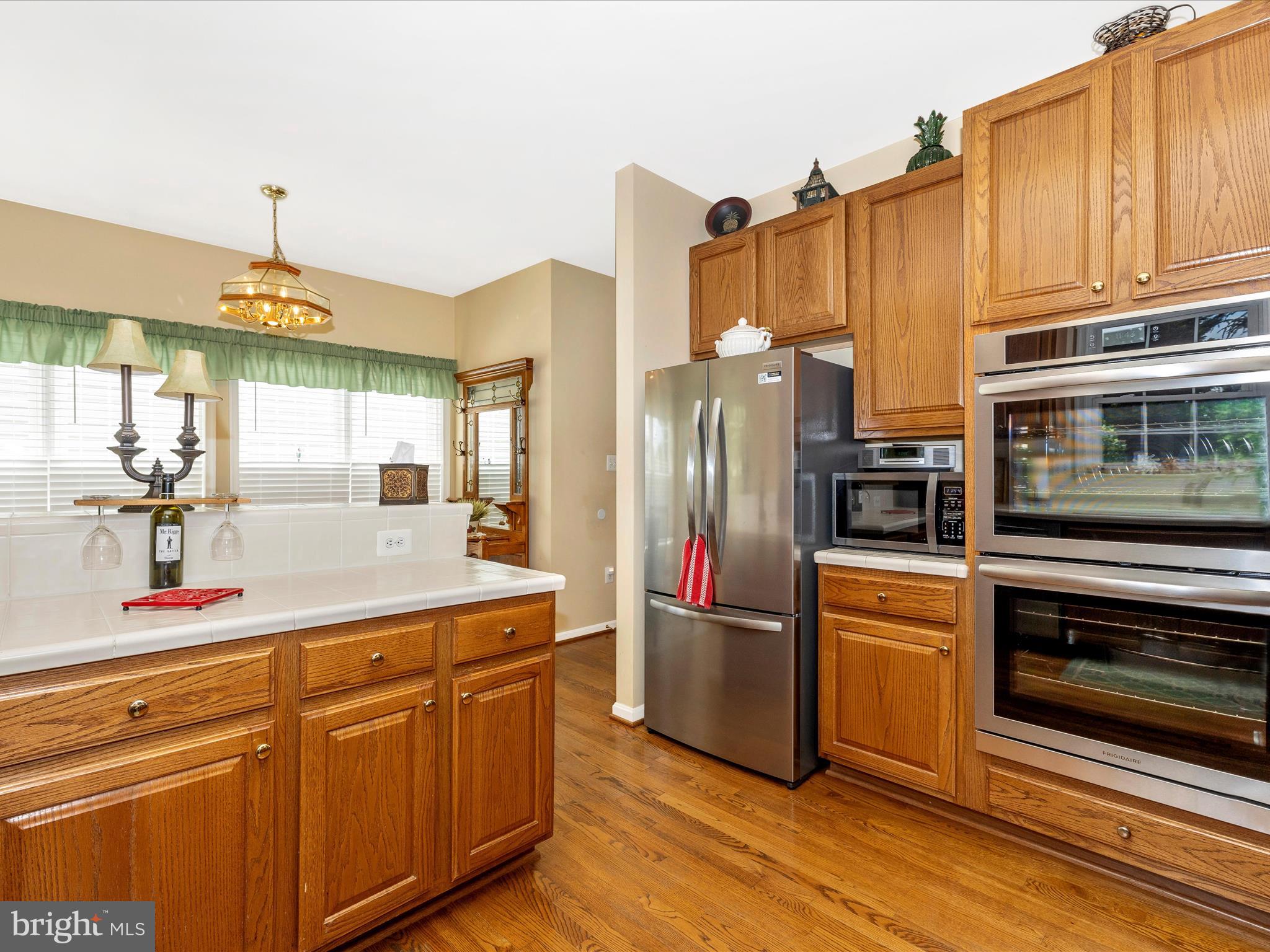 2594 Bear Den Road Frederick, MD 21701 - Photo 15 of 72 a kitchen with stainless steel appliances granite countertop a refrigerator and a stove
