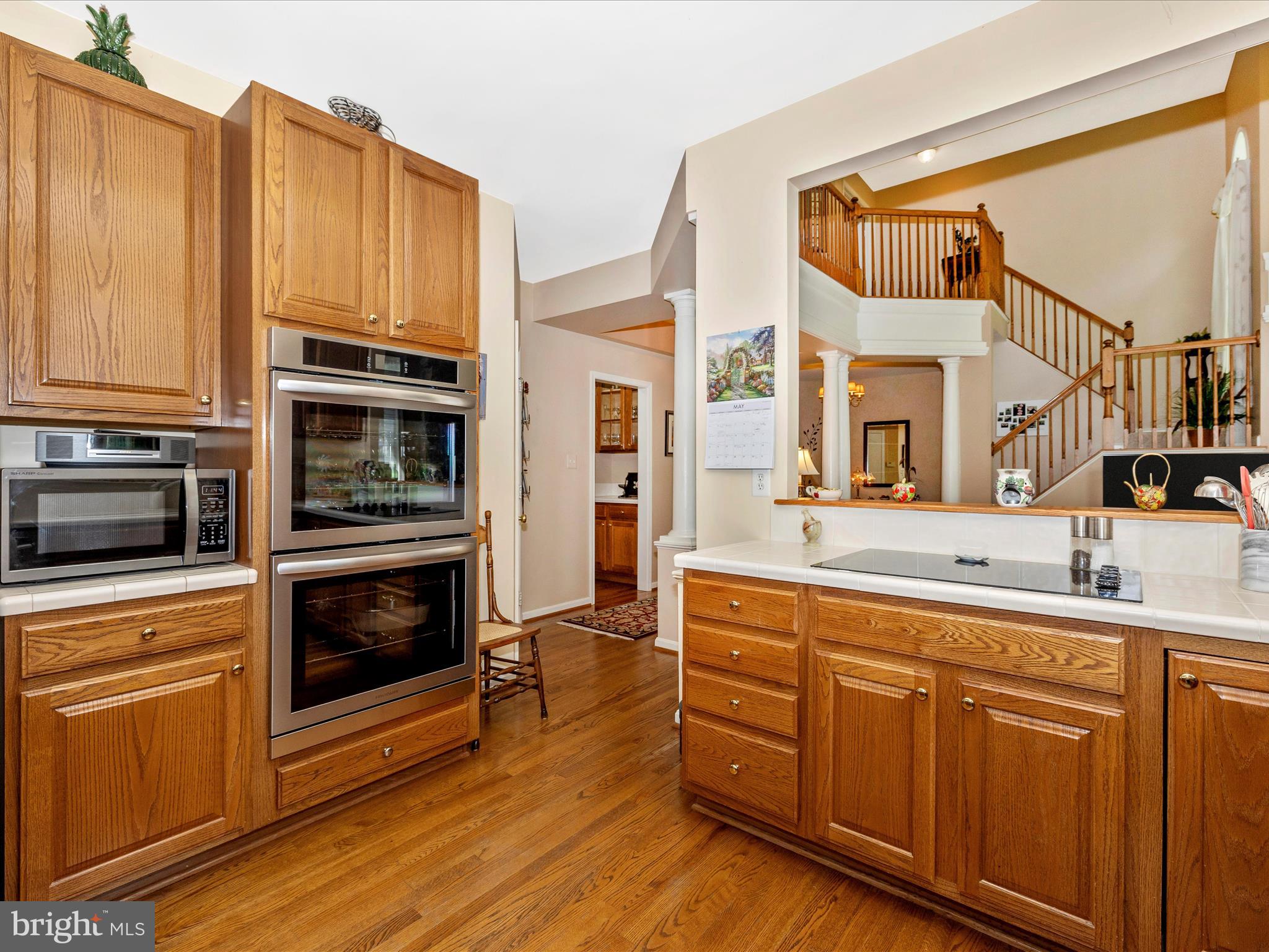 2594 Bear Den Road Frederick, MD 21701 - Photo 16 of 72 a kitchen with stainless steel appliances granite countertop a stove and a sink