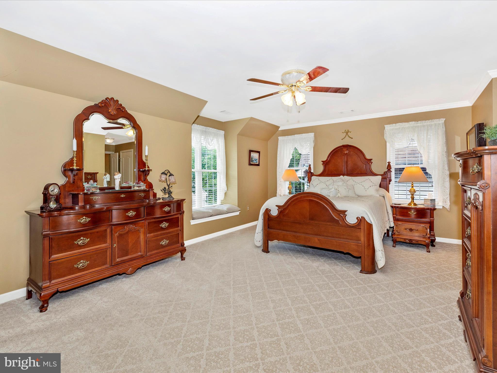 2594 Bear Den Road Frederick, MD 21701 - Photo 23 of 72 a bedroom with a bed and a chandelier