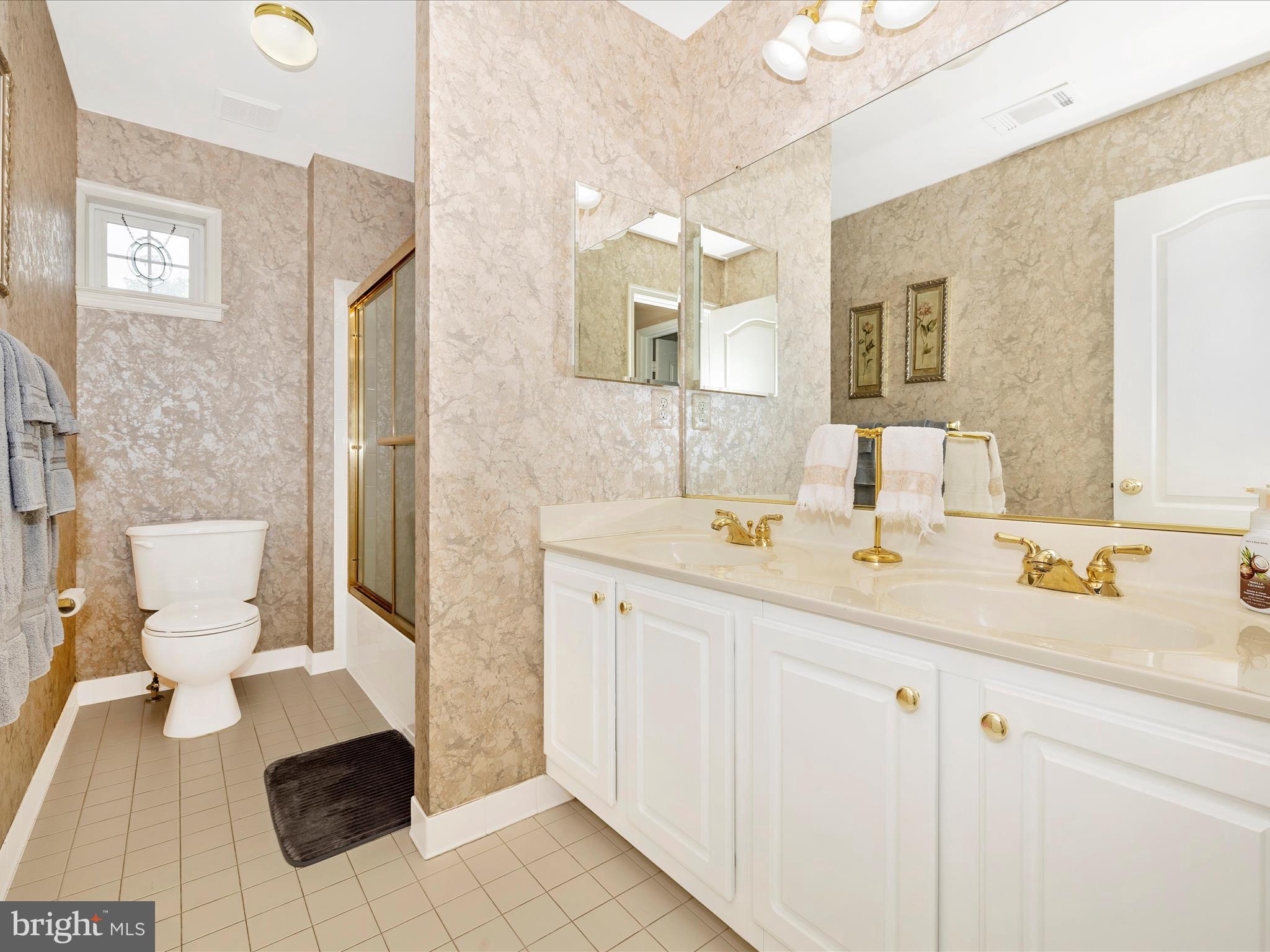 2594 Bear Den Road Frederick, MD 21701 - Photo 34 of 72 a bathroom with a sink and a mirror