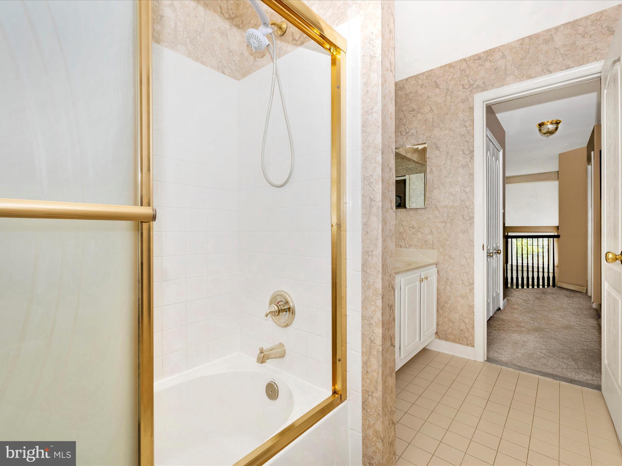 2594 Bear Den Road Frederick, MD 21701 - Photo 35 of 72 a bathroom with a glass shower door