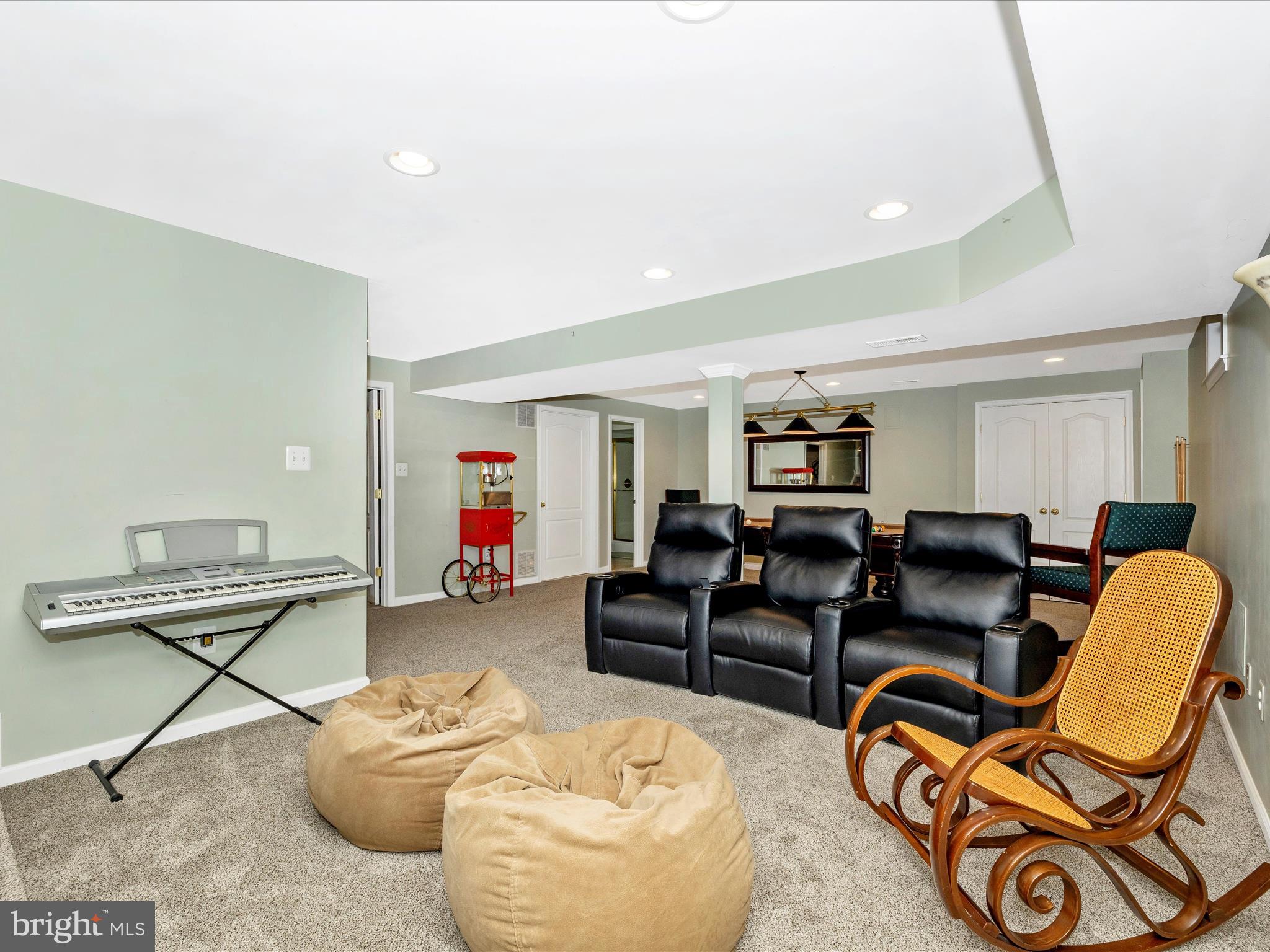 2594 Bear Den Road Frederick, MD 21701 - Photo 40 of 72 a living room with furniture and a gym machine