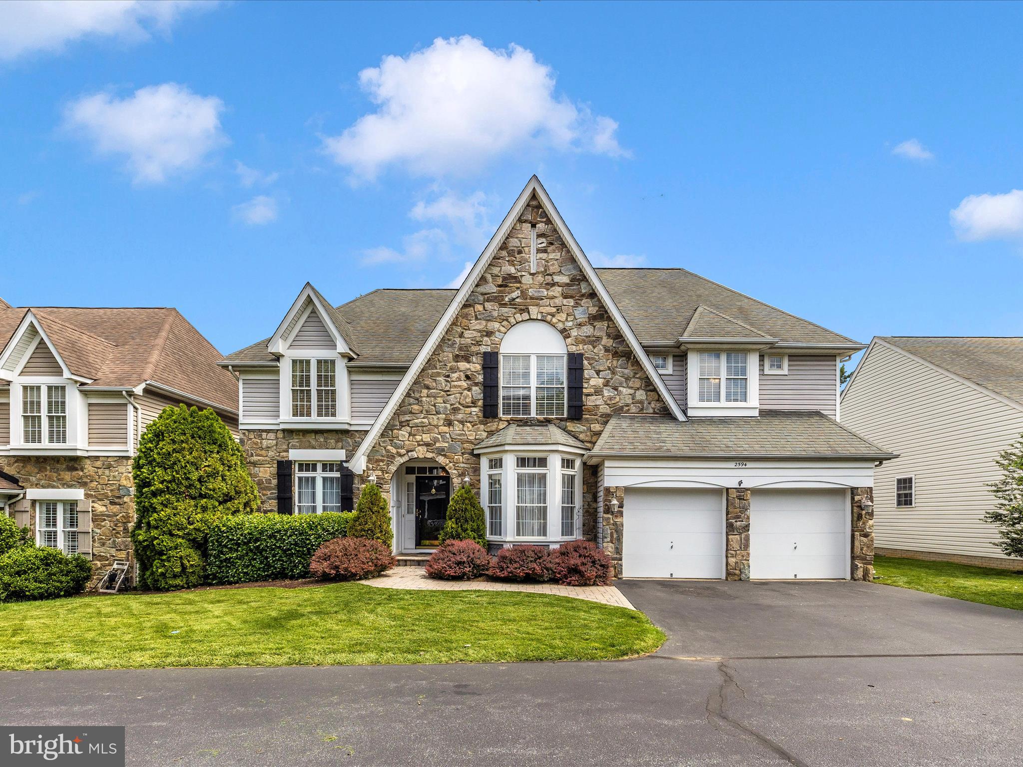 2594 Bear Den Road Frederick, MD 21701 - Photo 46 of 72 a front view of a house with a garden and yard