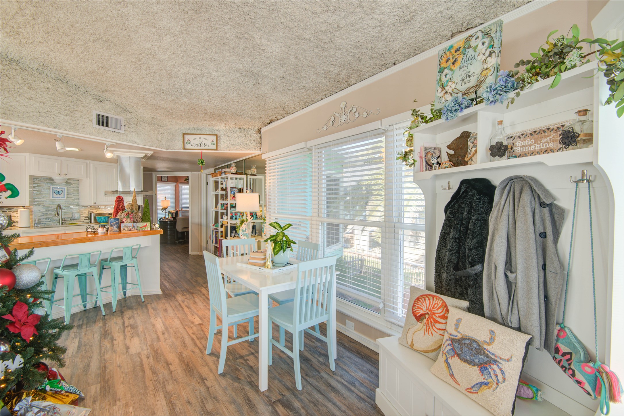 83 Dolphin Lane Freeport, TX 77541 - Photo 11 of 39 a view of a dining room with furniture and wooden floor