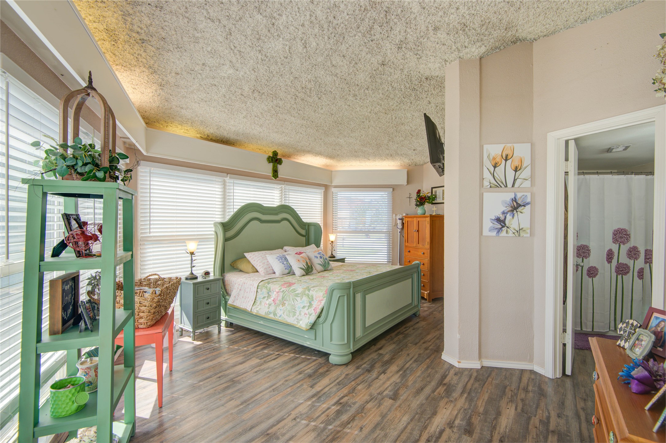 83 Dolphin Lane Freeport, TX 77541 - Photo 18 of 39 a bedroom with a bed and a mirror