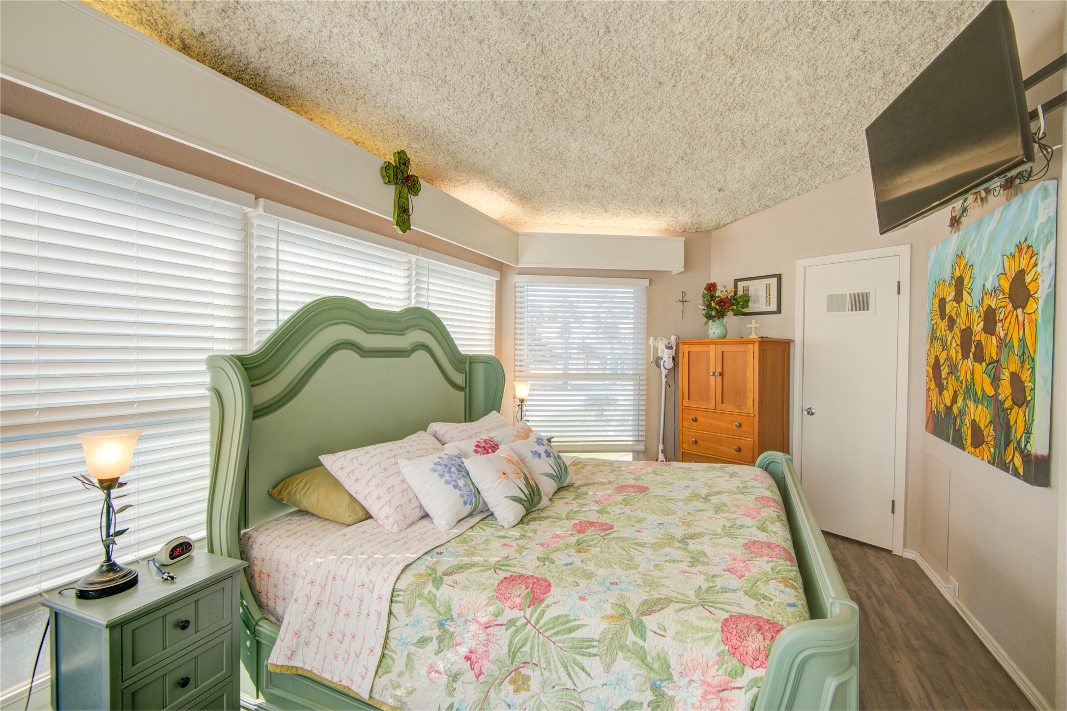83 Dolphin Lane Freeport, TX 77541 - Photo 19 of 39 a bedroom with a bed dresser and a window