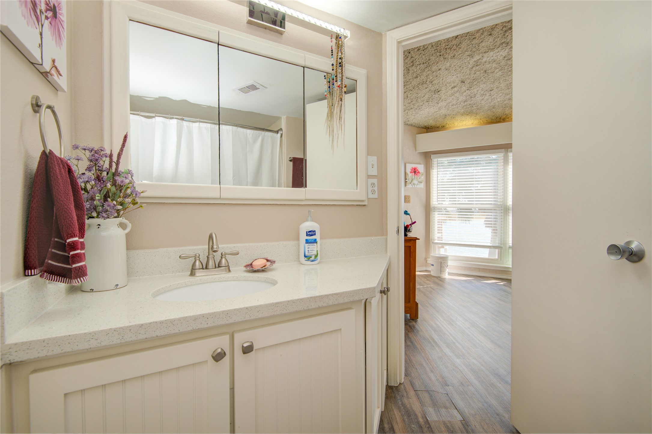 83 Dolphin Lane Freeport, TX 77541 - Photo 22 of 39 a bathroom with a sink and a mirror
