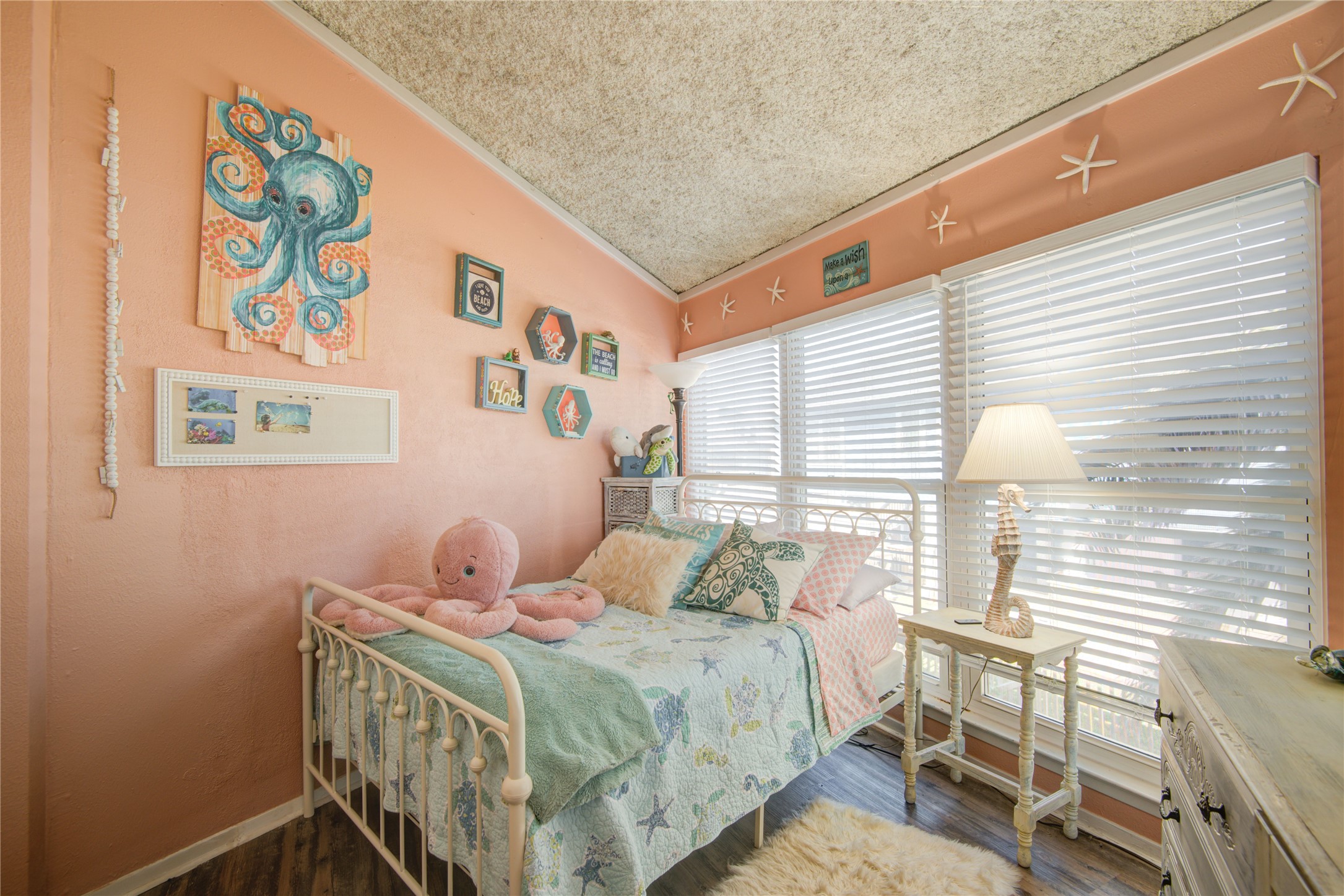 83 Dolphin Lane Freeport, TX 77541 - Photo 23 of 39 a bedroom with a bed and a window