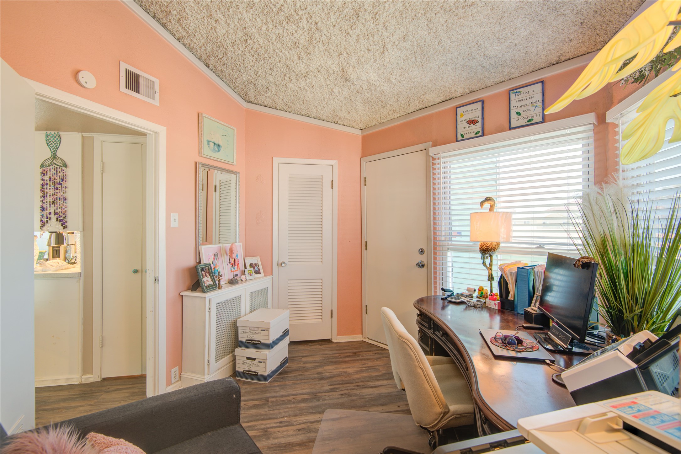 83 Dolphin Lane Freeport, TX 77541 - Photo 27 of 39 a view of a workspace with furniture and a window