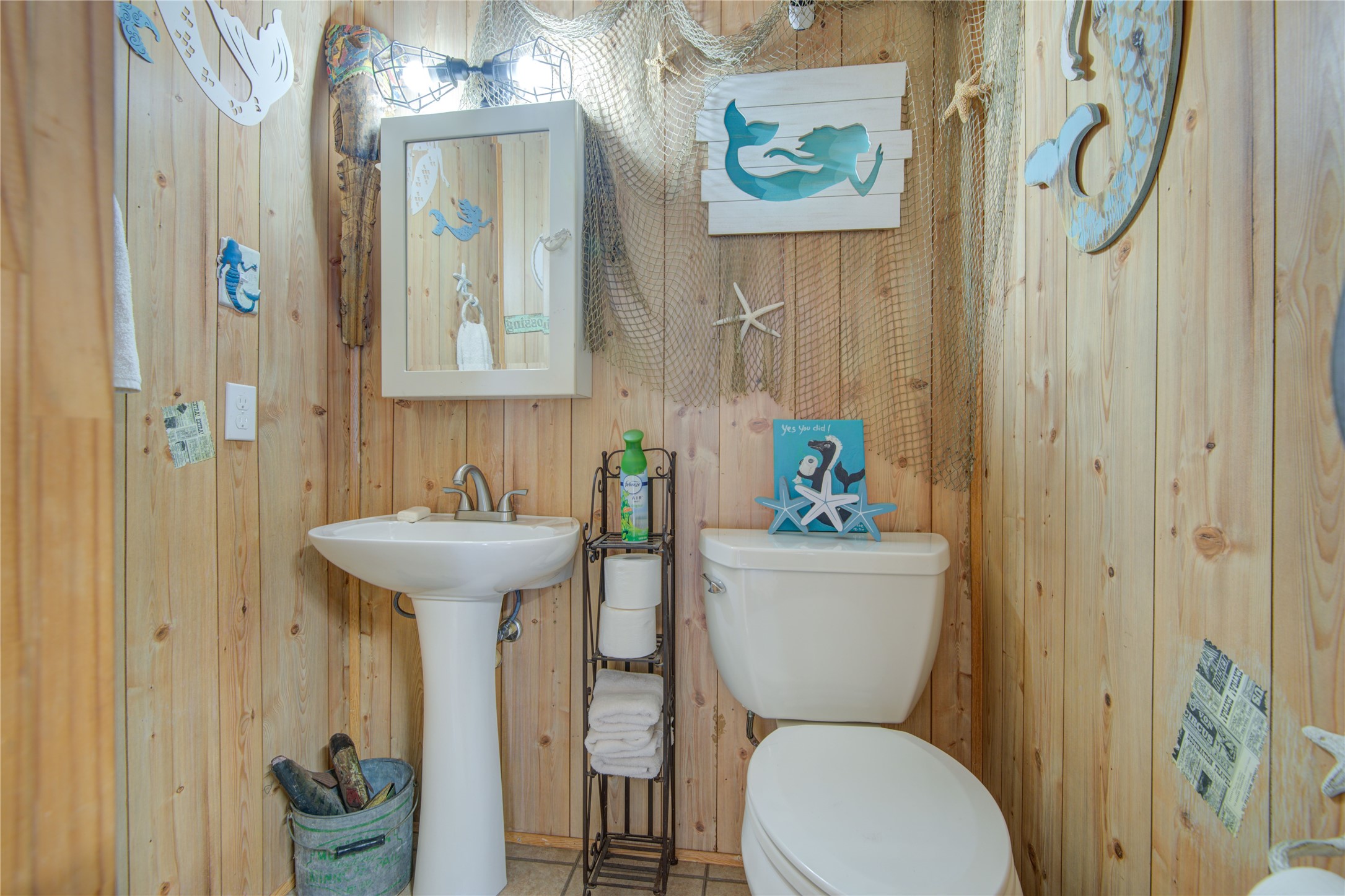 83 Dolphin Lane Freeport, TX 77541 - Photo 39 of 39 a bathroom with a sink mirror toilet and bathtub