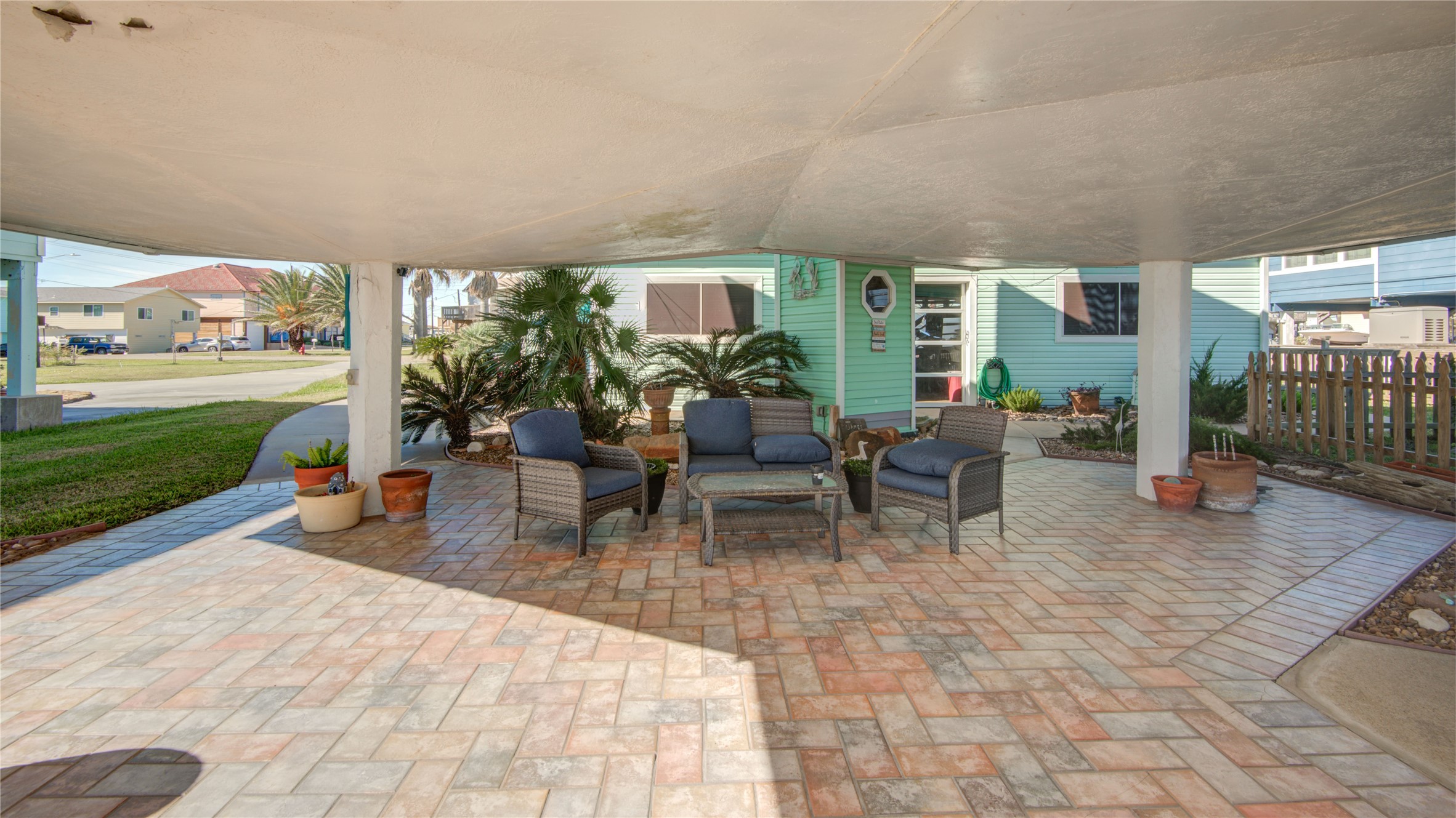 83 Dolphin Lane Freeport, TX 77541 - Photo 4 of 39 a outdoor space with lots of tables a garden and chairs