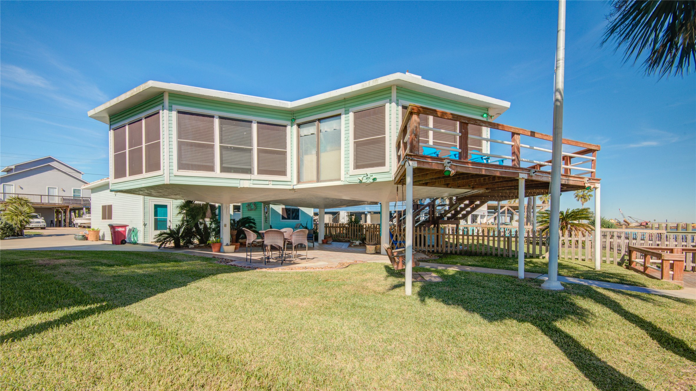 83 Dolphin Lane Freeport, TX 77541 - Photo 6 of 39 a front view of a house with a yard