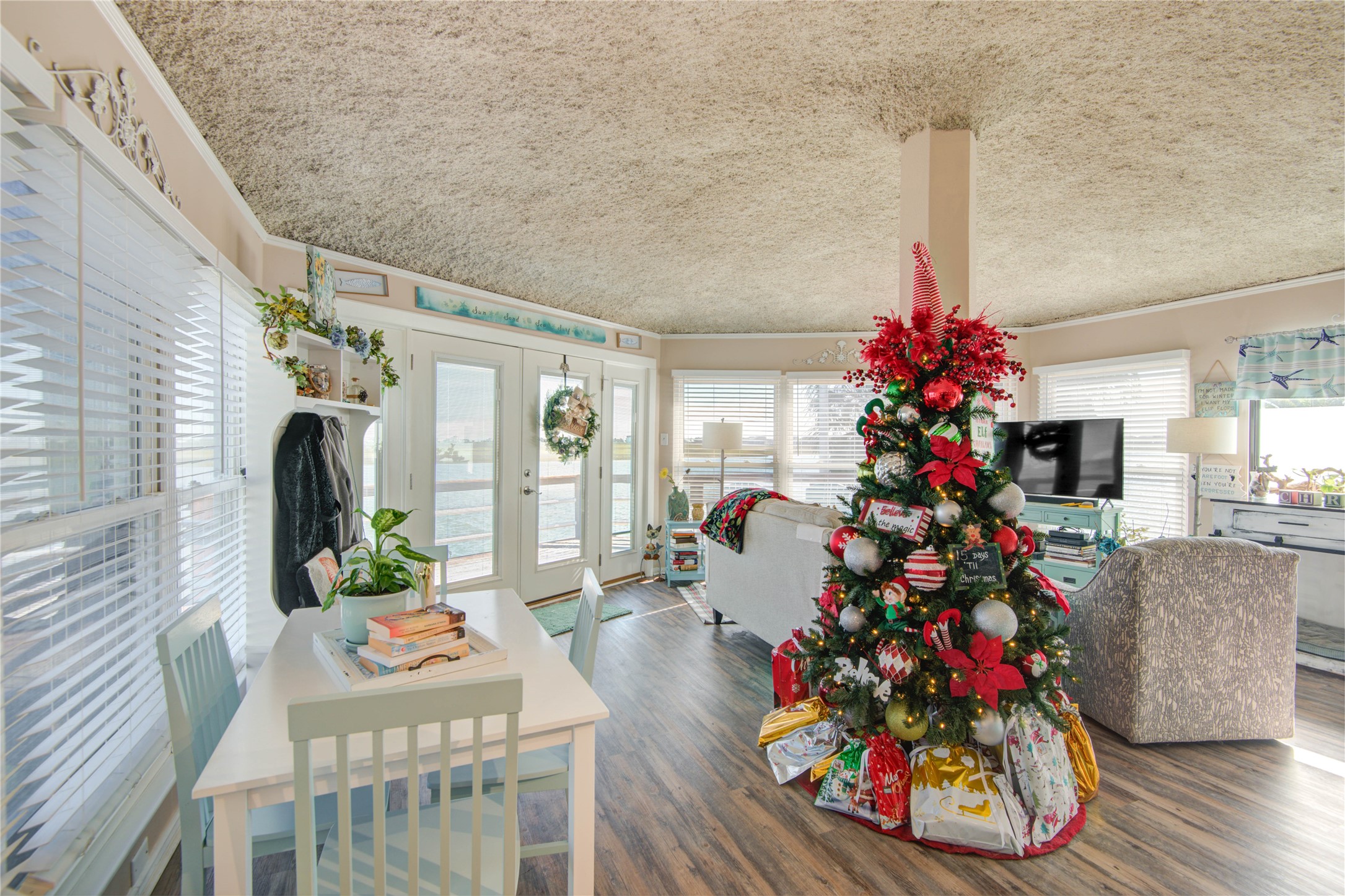 83 Dolphin Lane Freeport, TX 77541 - Photo 10 of 39 a vase of flowers sitting on a wooden floor