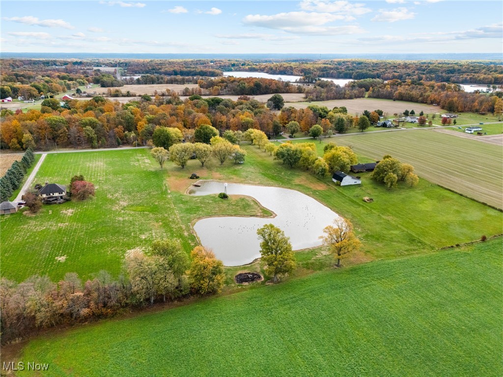 14265 Reeder Avenue Northeast Alliance, OH 44601 - Photo 35 of 39 Aerial view of sparsely populated area with a nearby body of water and large plots for crops