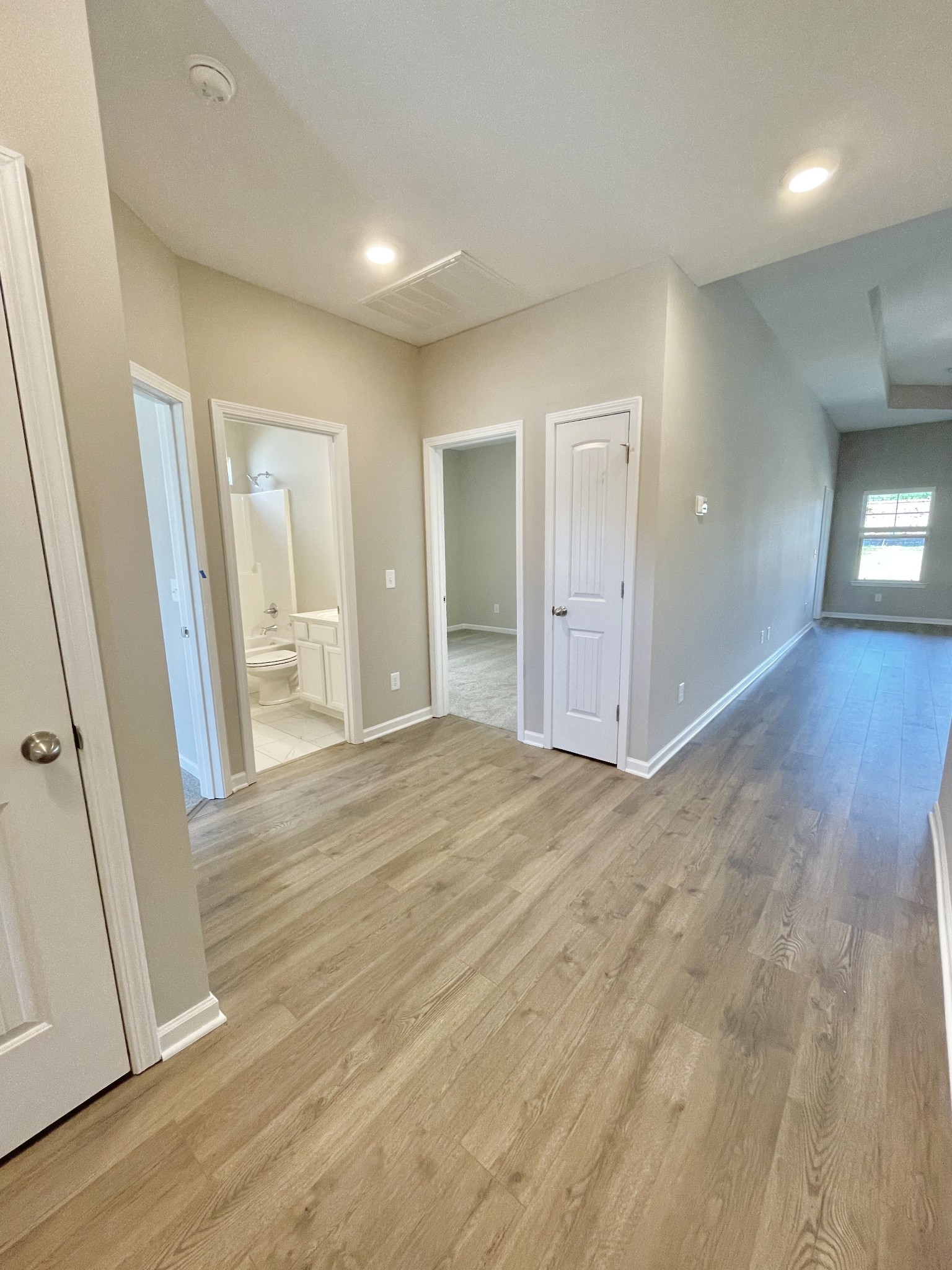 311 Moccasin Trail Spring Hill, TN 37174 - Photo 3 of 18 an empty room with wooden floor and entrance