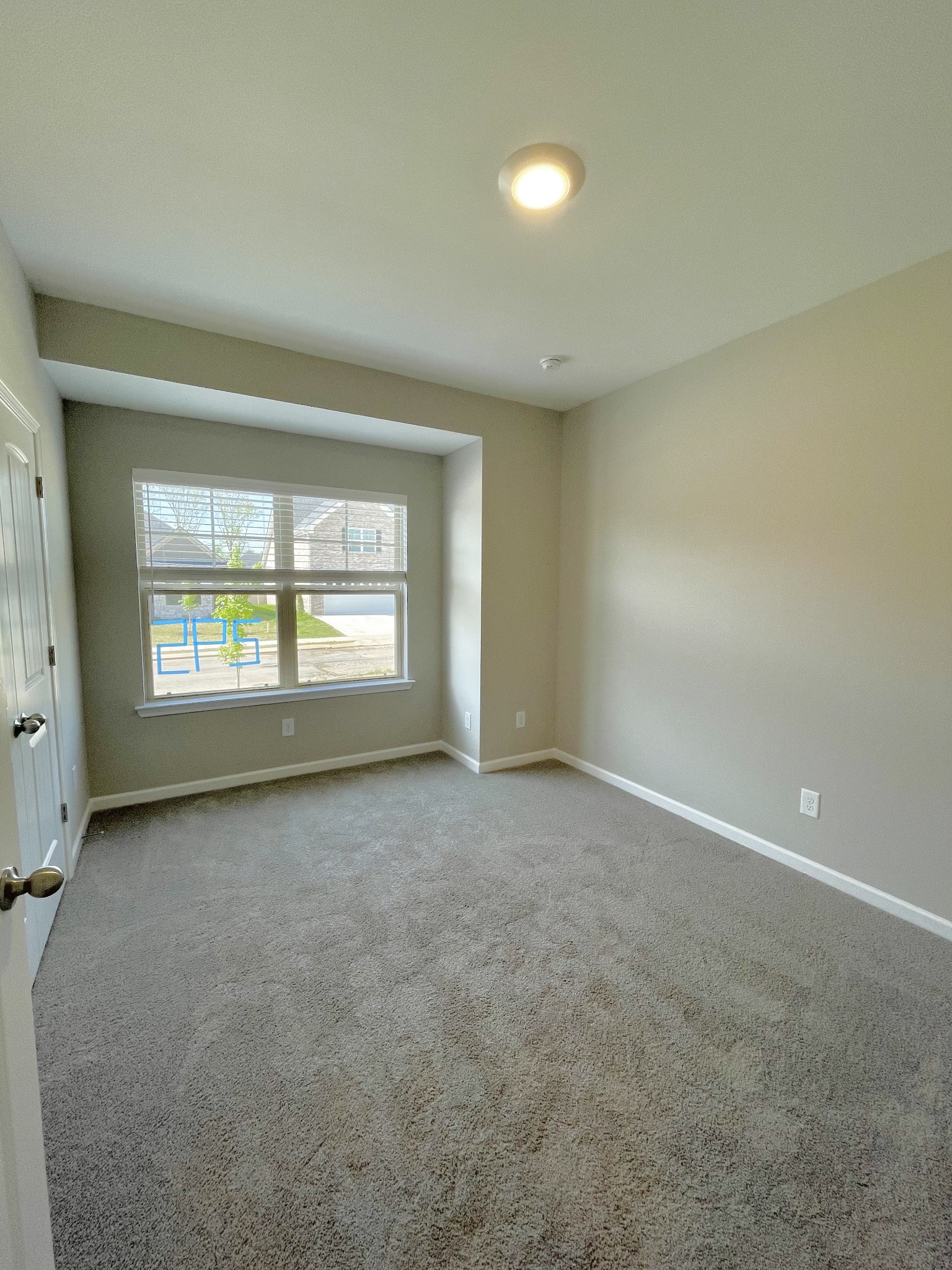 311 Moccasin Trail Spring Hill, TN 37174 - Photo 6 of 18 an empty room with a window and doors