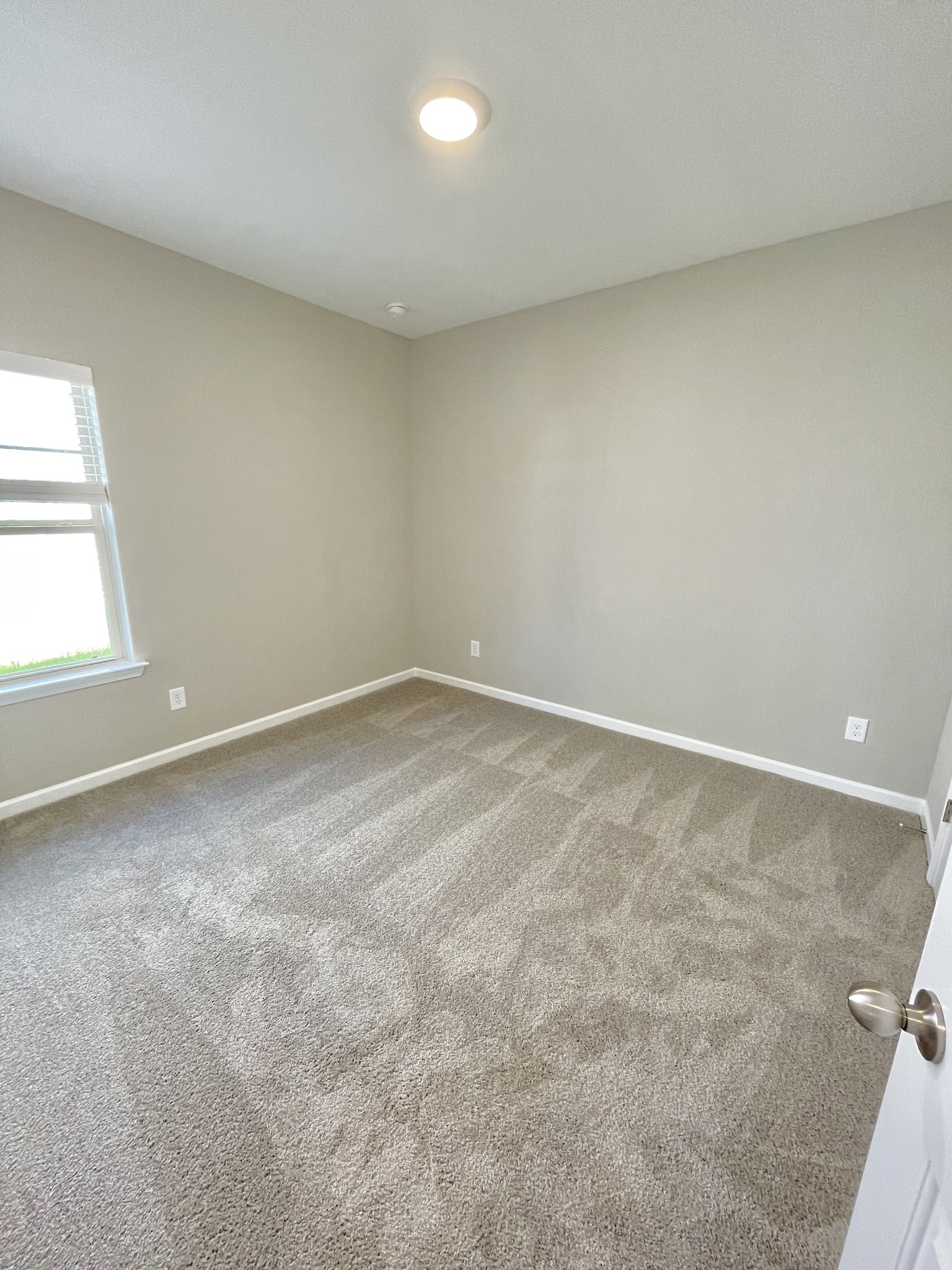 311 Moccasin Trail Spring Hill, TN 37174 - Photo 8 of 18 an empty room with a window