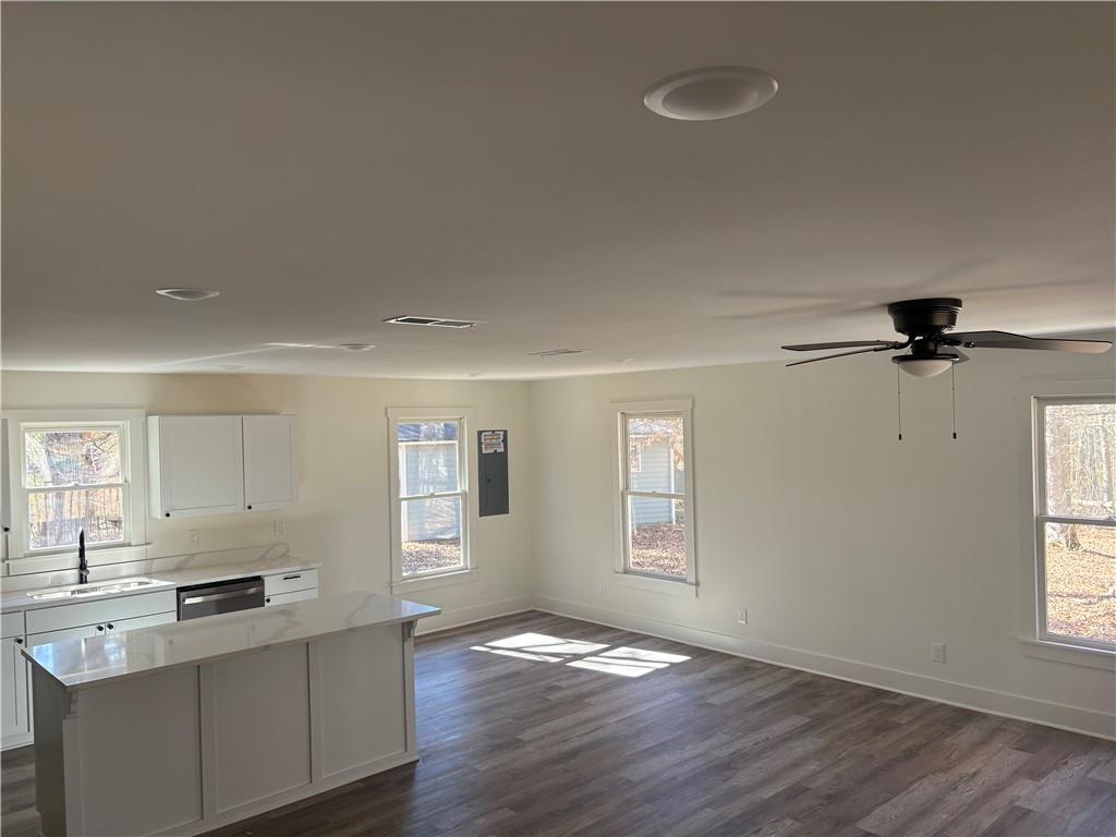59 Woodhaven Path Rockmart, GA 30153 - Photo 2 of 17 a view of an empty room with a window and wooden floor