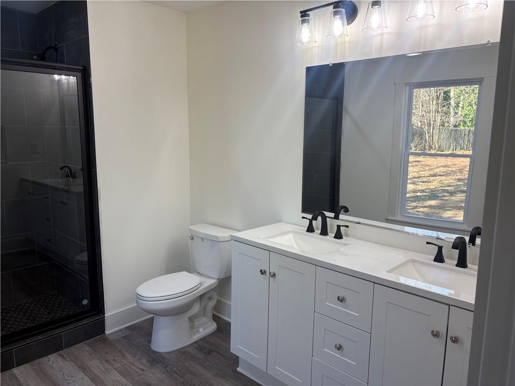 59 Woodhaven Path Rockmart, GA 30153 - Photo 10 of 17 a bathroom with a toilet a sink and mirror