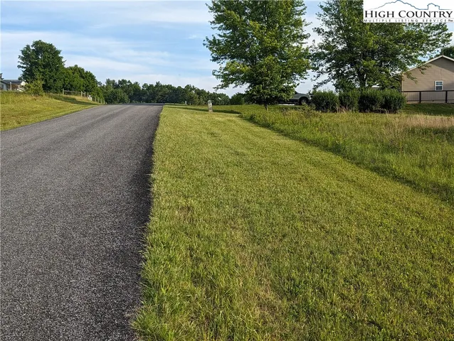 a view of a town with mountains in the background