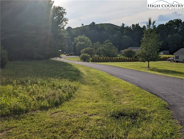 a view of a garden with an outdoor seating