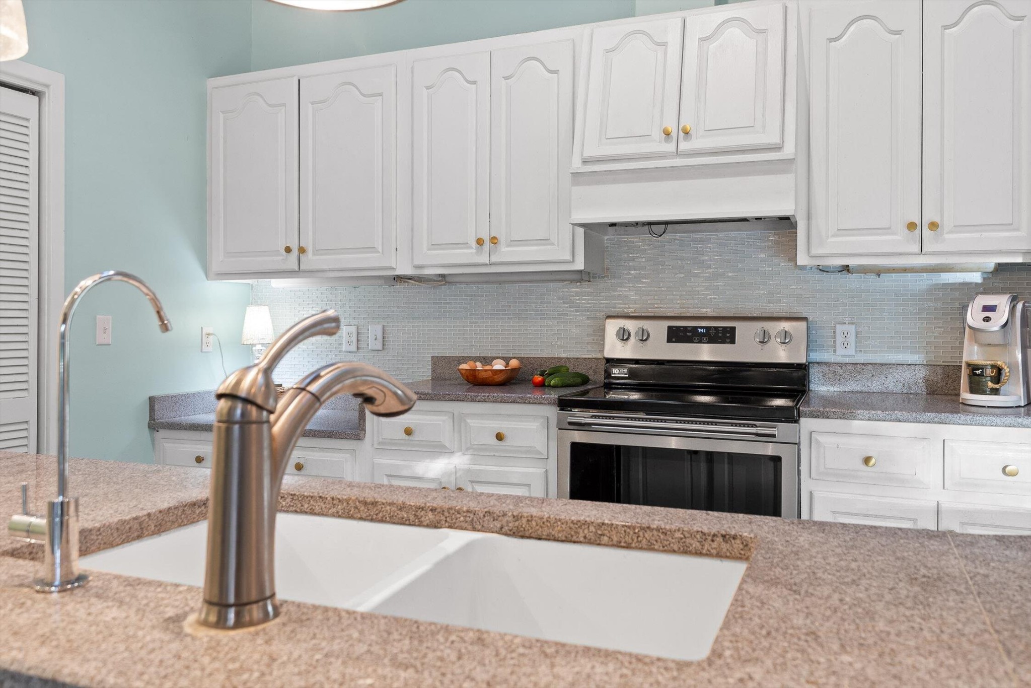 657 Brock Road Chickamauga, GA 30707 - Photo 25 of 55 a kitchen with granite countertop white cabinets and stainless steel appliances