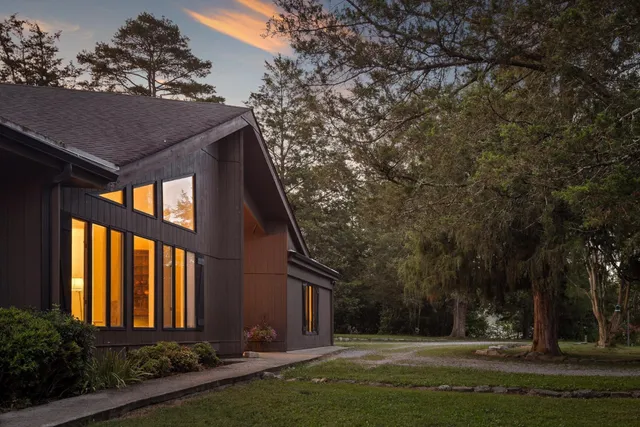 a front view of house with yard and green space