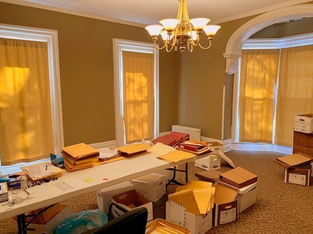 438 North Sheridan Road Waukegan, IL 60085 - Photo 6 of 21 a bedroom with a bed and a chandelier