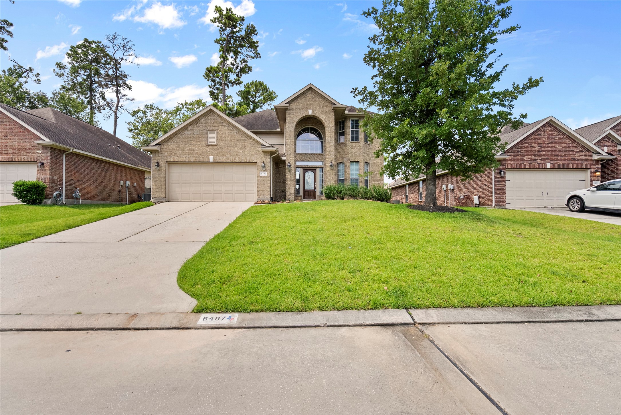 6407 Pine Rest Drive Spring, TX 77389 - Photo 3 of 26 a house view with a garden space