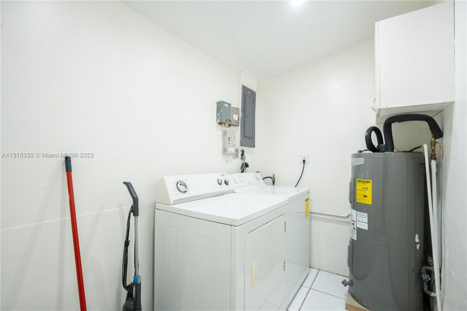9215 Southwest 45th Street, Unit 9215 Miami, FL 33165 - Photo 16 of 37 a bathroom with a sink and toilet