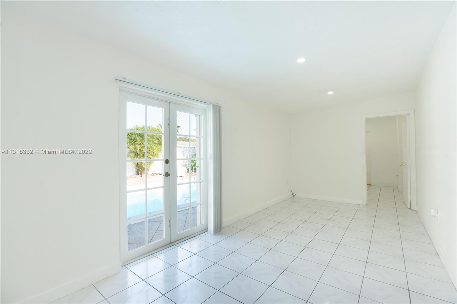 9215 Southwest 45th Street, Unit 9215 Miami, FL 33165 - Photo 17 of 37 an empty room with windows