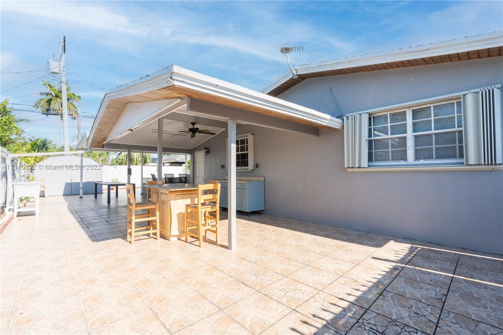 9215 Southwest 45th Street, Unit 9215 Miami, FL 33165 - Photo 26 of 37 a view of a lounge chairs in the patio