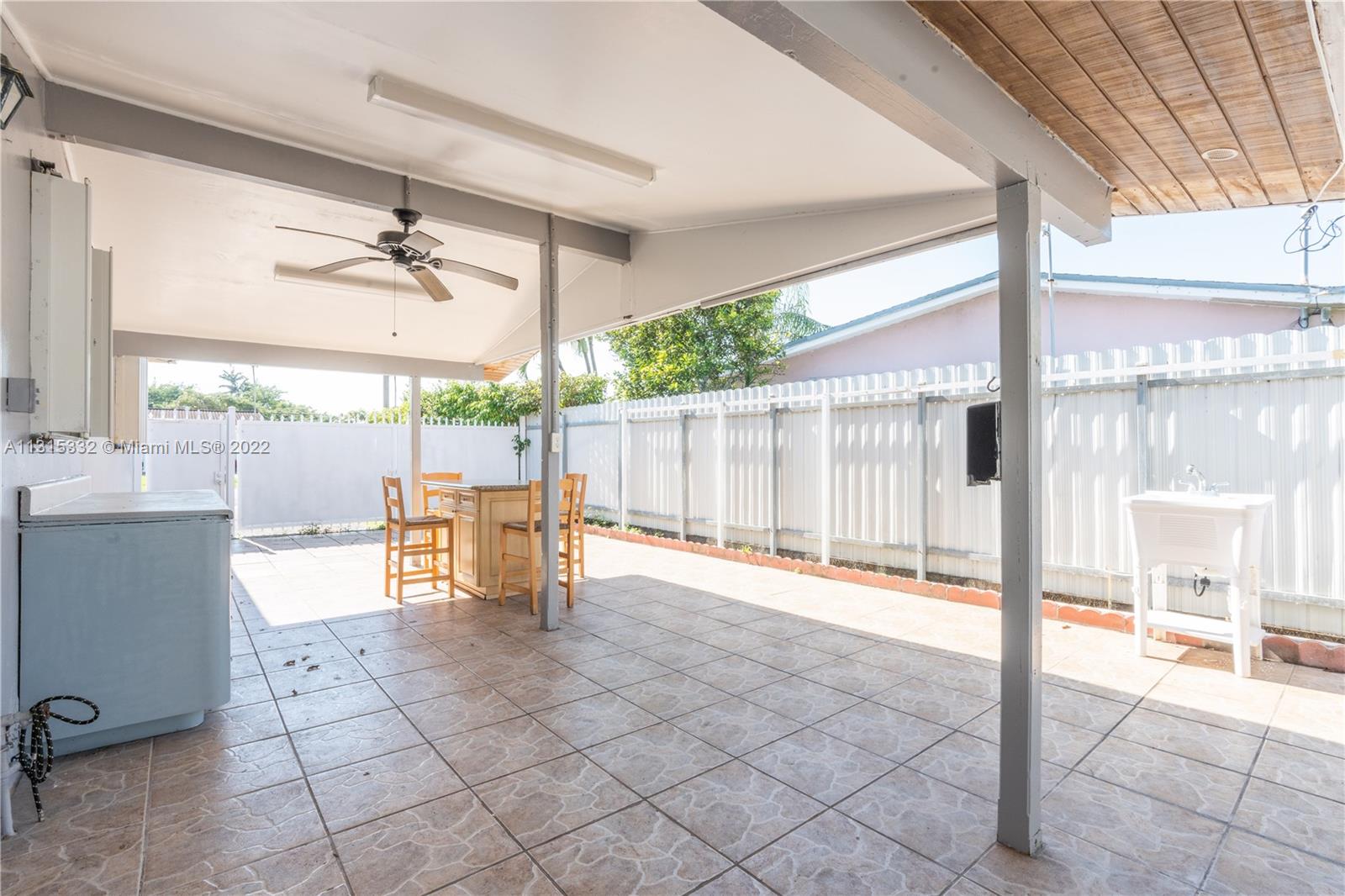 9215 Southwest 45th Street, Unit 9215 Miami, FL 33165 - Photo 27 of 37 a view of an outdoor space with seating area