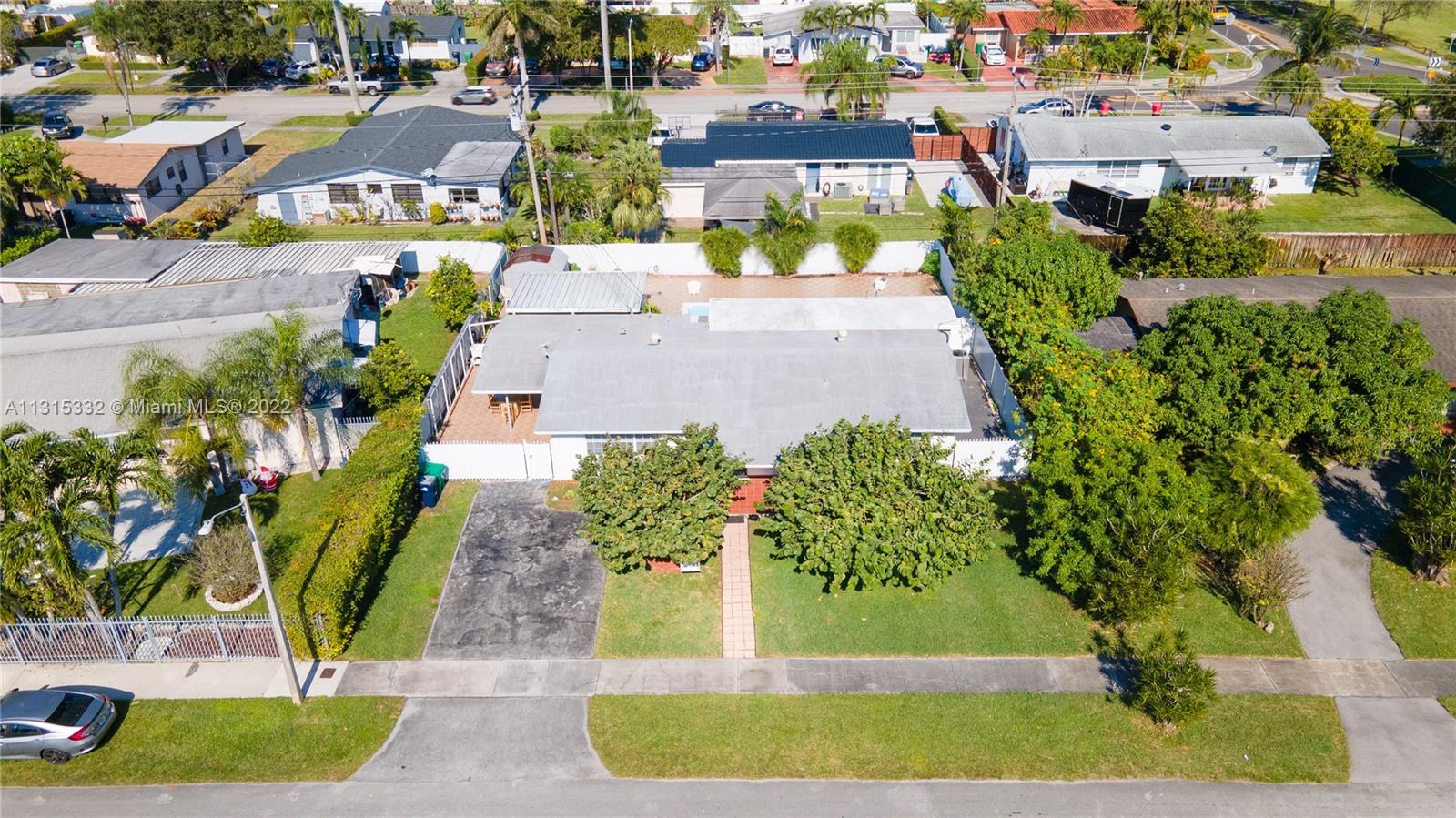 9215 Southwest 45th Street, Unit 9215 Miami, FL 33165 - Photo 34 of 37 an aerial view of a house with a yard basket ball court and outdoor seating
