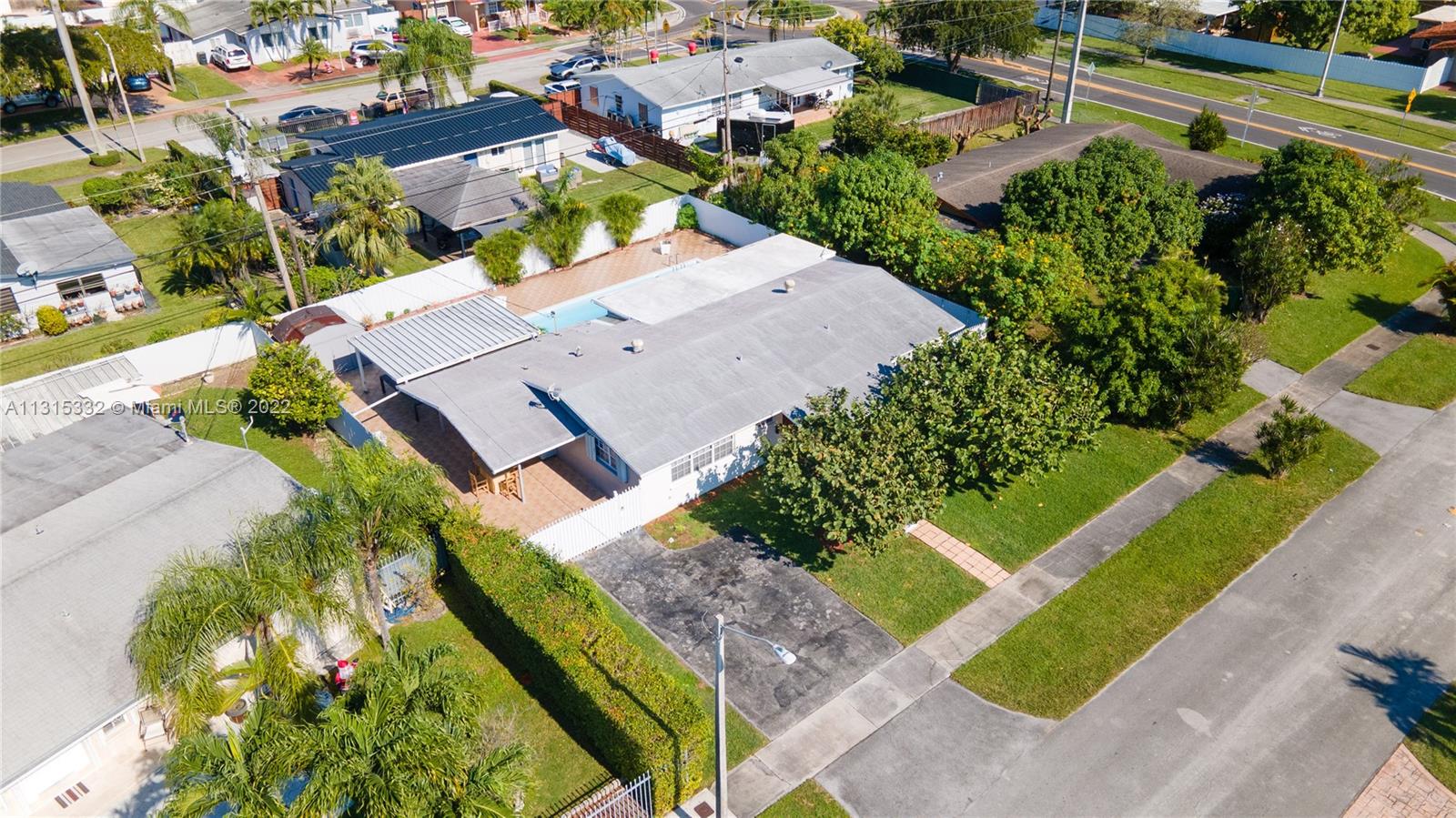 9215 Southwest 45th Street, Unit 9215 Miami, FL 33165 - Photo 35 of 37 an aerial view of a house with a garden