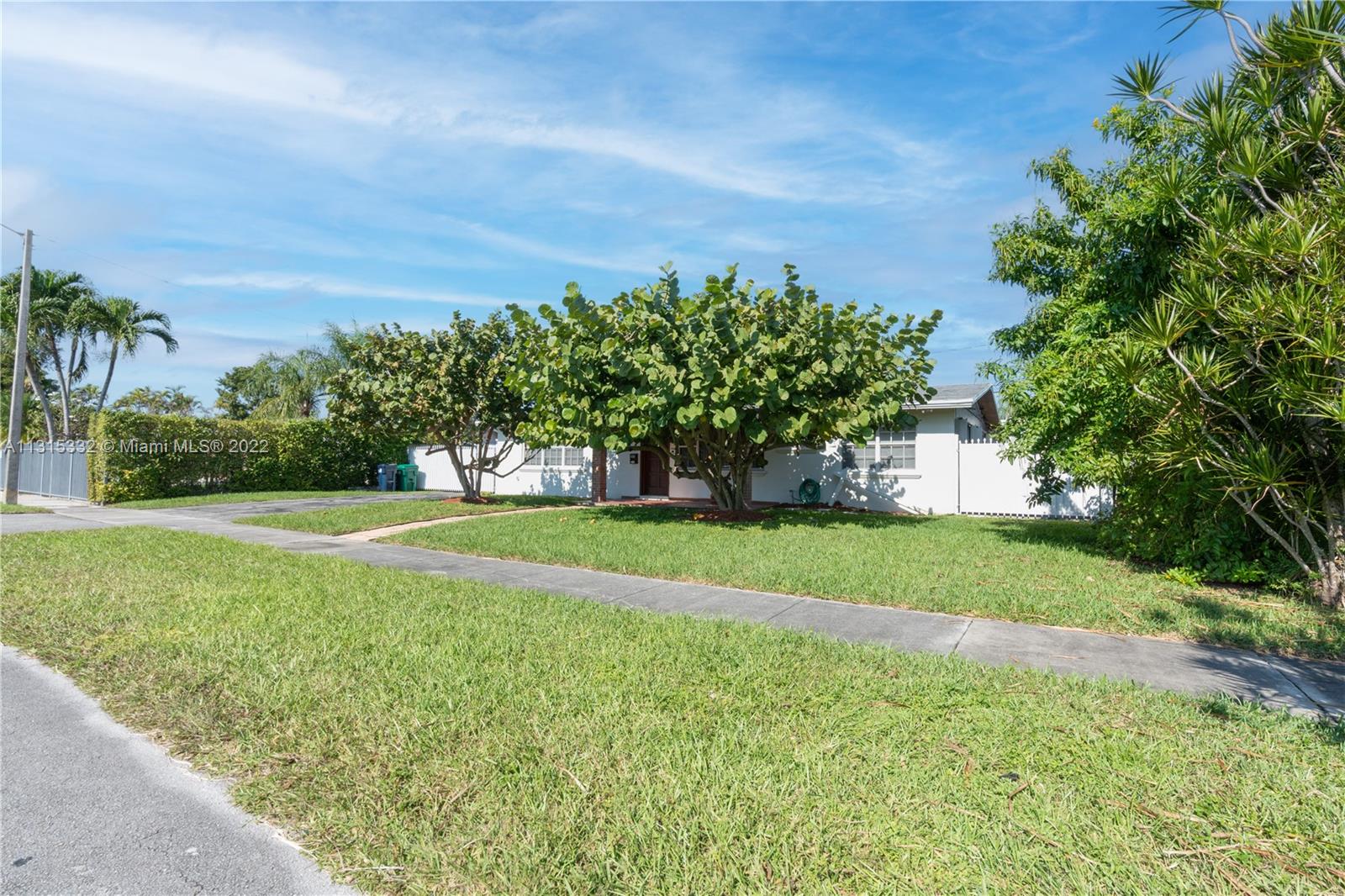 9215 Southwest 45th Street, Unit 9215 Miami, FL 33165 - Photo 36 of 37 a view of a field of grass and trees
