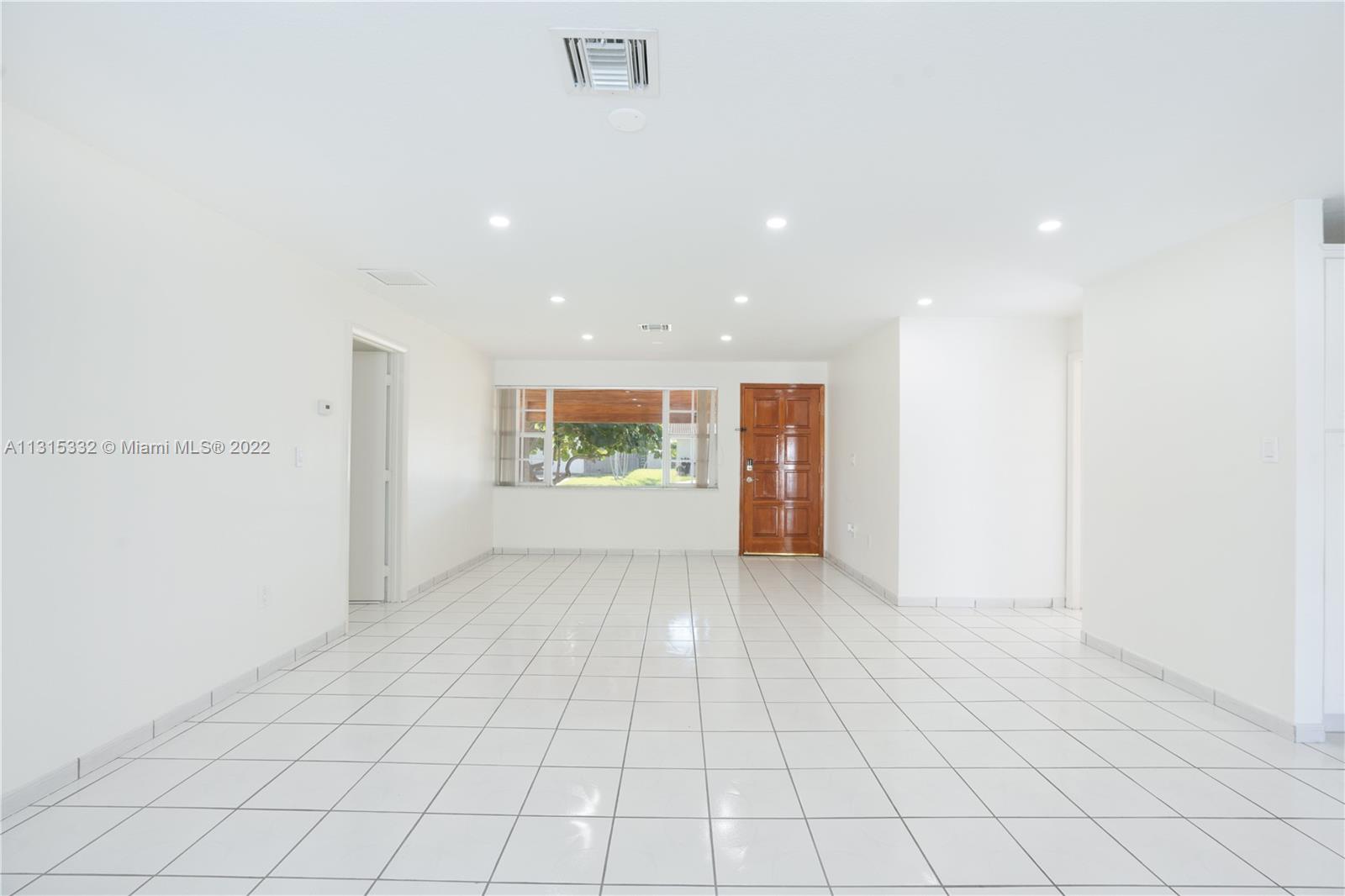 9215 Southwest 45th Street, Unit 9215 Miami, FL 33165 - Photo 4 of 37 a view of an empty room
