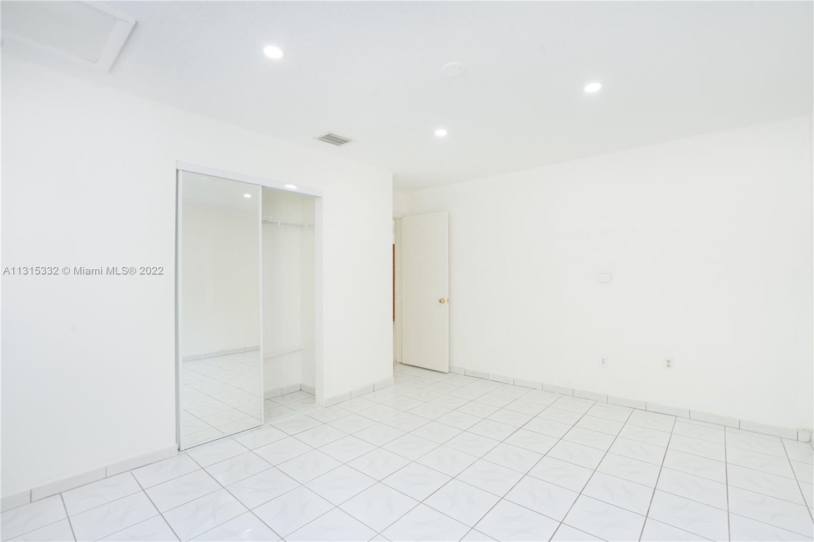 9215 Southwest 45th Street, Unit 9215 Miami, FL 33165 - Photo 10 of 37 a view of an empty room