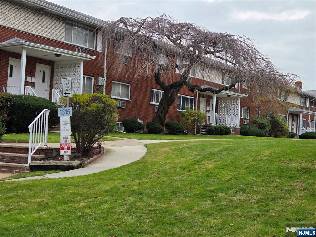 1315 Anderson Avenue, Unit 5 Fort Lee, NJ 07024 - Photo 13 of 16 a front view of a house with garden