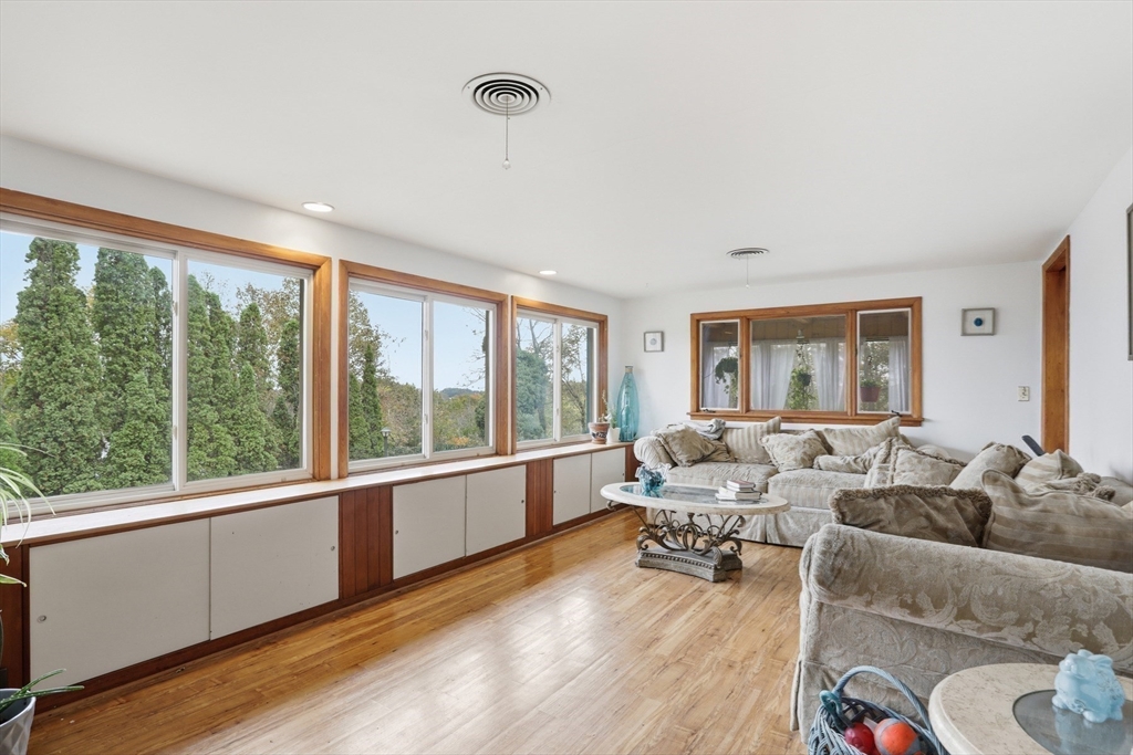 22 Burdett Road Lynn, MA 01904 - Photo 15 of 30 a living room with furniture and large windows