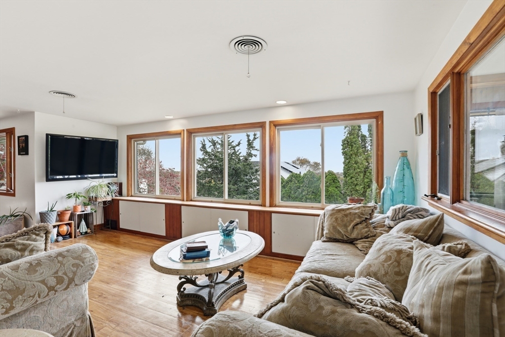 22 Burdett Road Lynn, MA 01904 - Photo 16 of 30 a living room with furniture and a flat screen tv