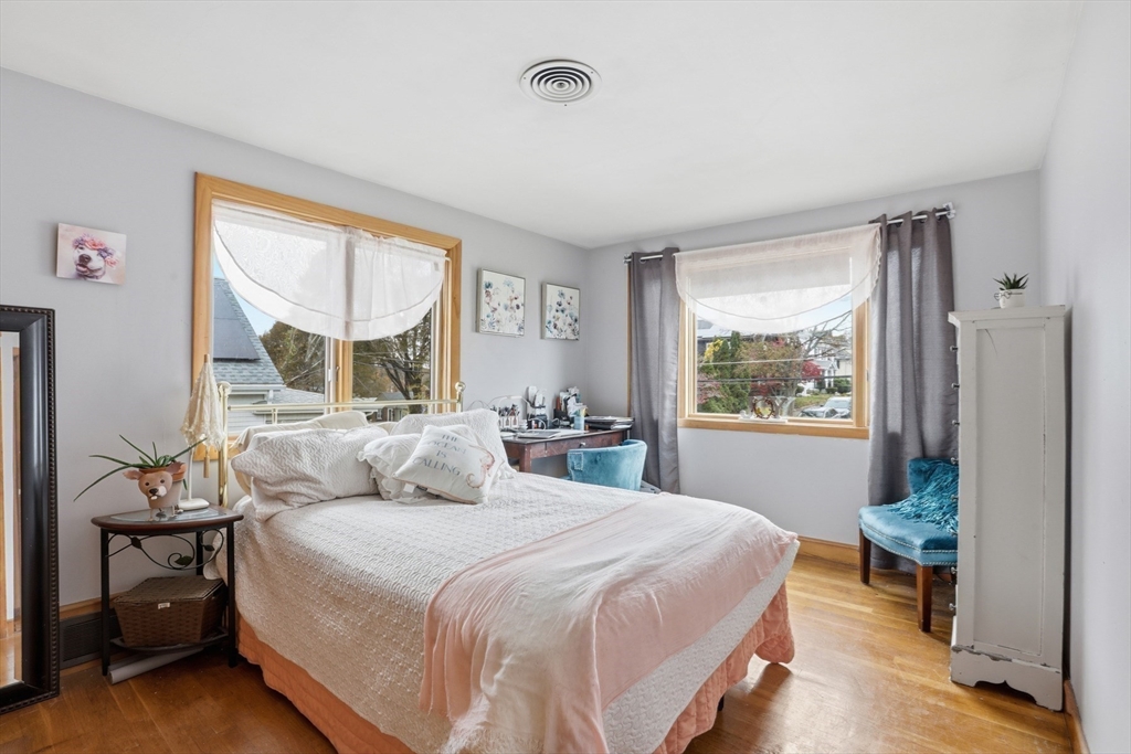 22 Burdett Road Lynn, MA 01904 - Photo 18 of 30 a bedroom with a large bed and a window