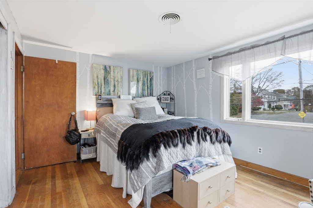 22 Burdett Road Lynn, MA 01904 - Photo 19 of 30 a bedroom with a bed and a large window