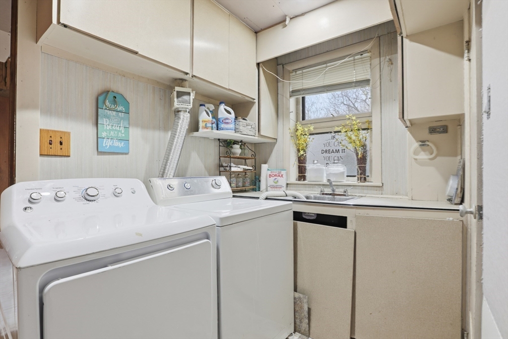 22 Burdett Road Lynn, MA 01904 - Photo 21 of 30 a view of kitchen with window and refrigerator