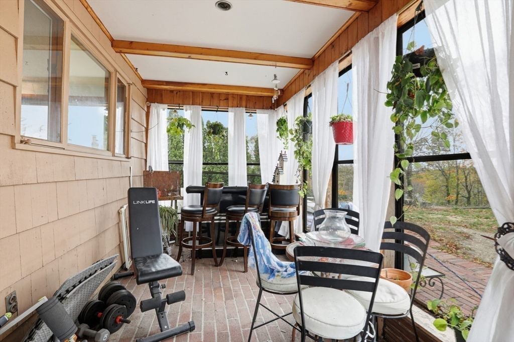 22 Burdett Road Lynn, MA 01904 - Photo 22 of 30 a view of a dining room with furniture window and outside view
