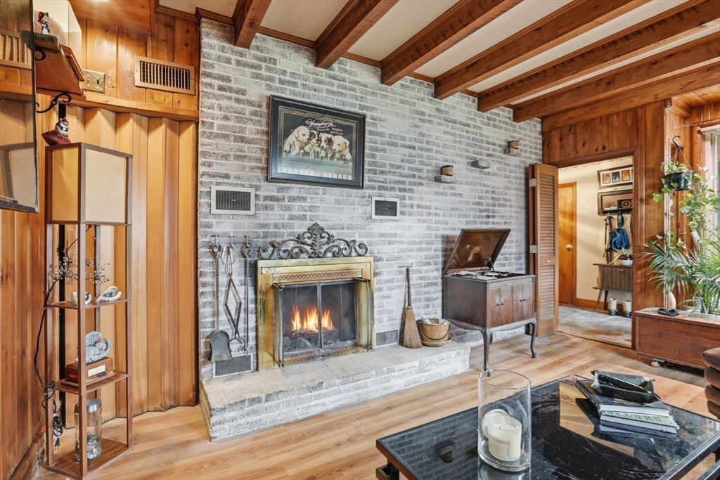 22 Burdett Road Lynn, MA 01904 - Photo 4 of 30 a living room with furniture and a fireplace