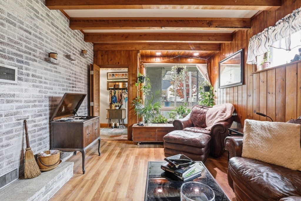 22 Burdett Road Lynn, MA 01904 - Photo 5 of 30 a living room with furniture and a fireplace